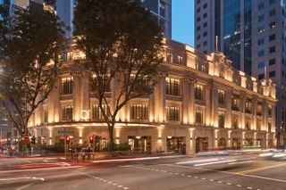 The neoclassical exterior of the QT Singapore hotel