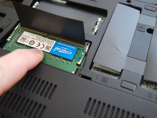 Press down to secure the RAM