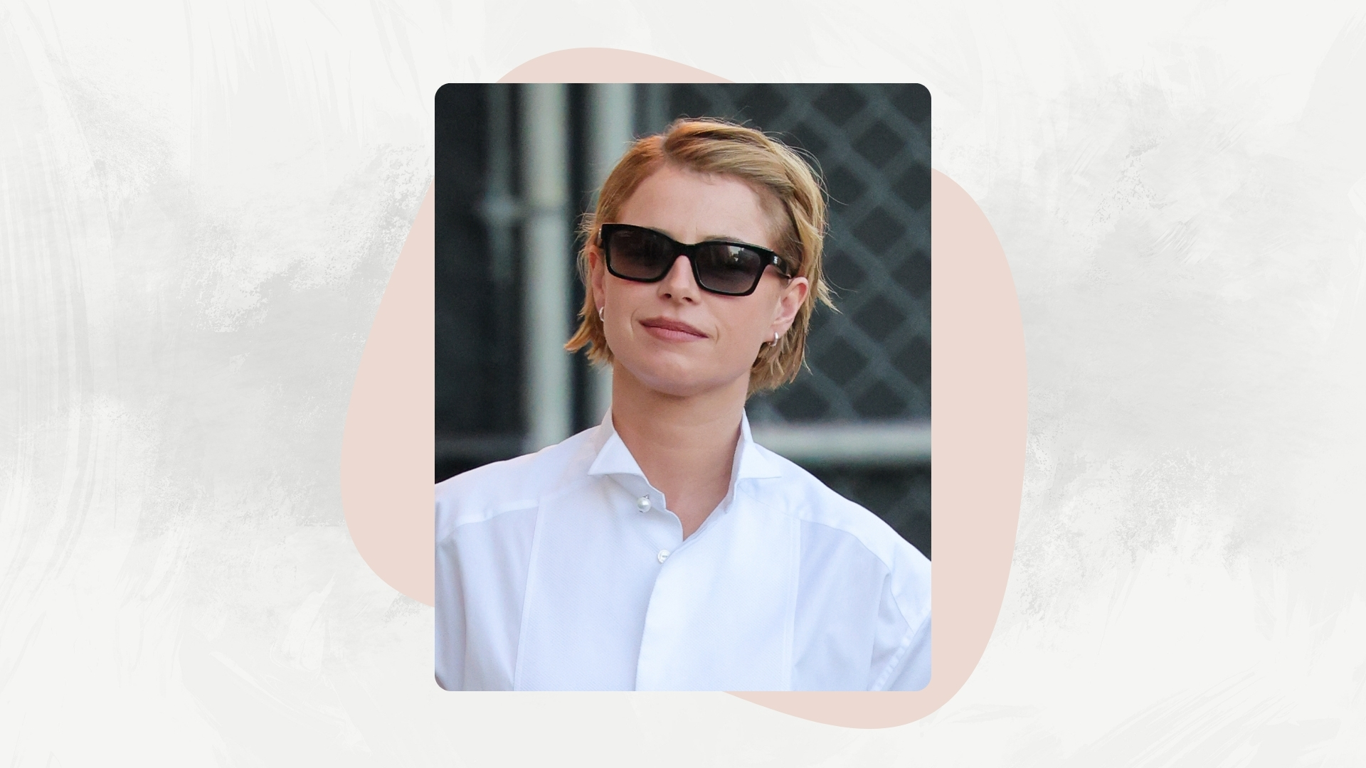 Jessie Buckley is seen on January 15, 2026 in Los Angeles, California, with a pixie cut hairstyle and wearing black sunglasses and a white shirt.