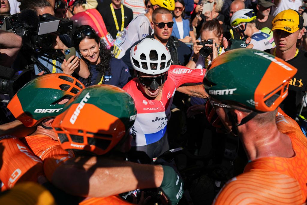 Tour de France stage 6: Dylan Groenewegen, complete with &#039;beak&#039;, celebrates the win with Jayco-AIUIa teammates