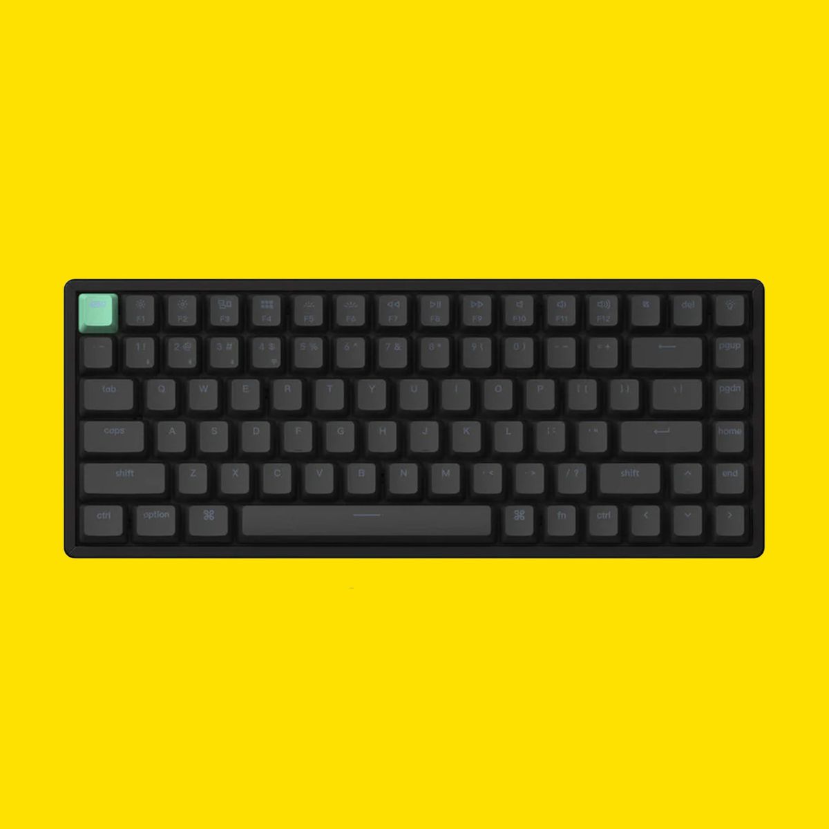 Keychron keyboard on yellow background.