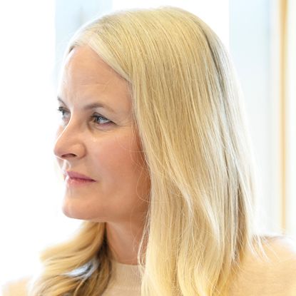 A headshot of Crown Princess Mette Marit looking serious