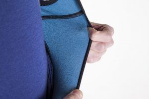 This image is someone showing the fleecy inside of a thermal jersey