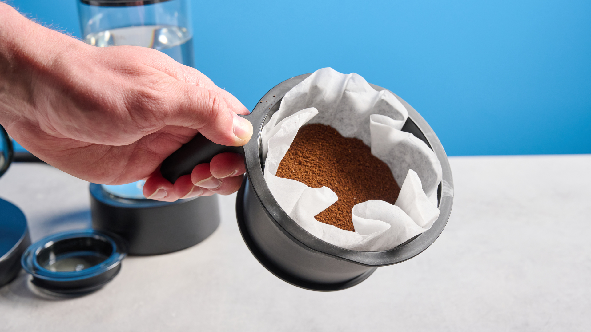 the ratio four coffee maker photographed against a blue tom's guide background