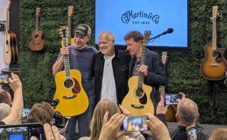 Peter Frampton (middle) at the Martin booth at NAMM 2025 in Anaheim, California