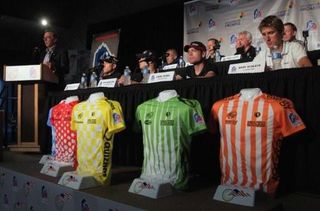 Steve Johnson (L) CEO of USA Cycling addresses the audience as race executives, dignitaries and riders conduct a press conference on the eve of the 2011 USA Pro Cycling Challenge
