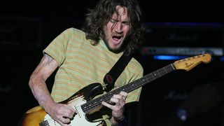 John Frusciante performs live with the Red Hot Chili Peppers