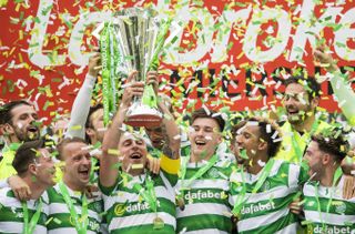 Celtic players celebrate with the Scottish Premiership trophy in May 2017.