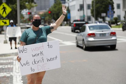 A teacher protests in Florida