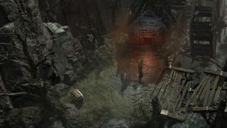Diablo 4 cellar locations - a rogue is standing in front of a glowing doorway