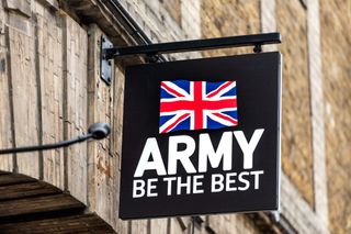 A black British Army sign hanging outside one of its recruitment centres
