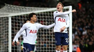 Christian Eriksen of Tottenham Hotspur celebrates after scoring his sides first goal with Dele Alli of Tottenham Hotspur during the Premier League match between Tottenham Hotspur and Manchester United at Wembley Stadium on January 31, 2018 in London, England.