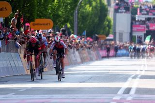 Team Cofidis' French rider Benjamin Thomas (R), Team Polti-Kometa's Italian rider Andrea Pietrobon (C) and Team EF Education's Danish rider Michael Valgren sprint to the finish line to win the 5th stage of the 107th Giro d'Italia cycling race, 178 km between Genova and Lucca, on May 8, 2024 in Lucca. (Photo by Luca Bettini / AFP)