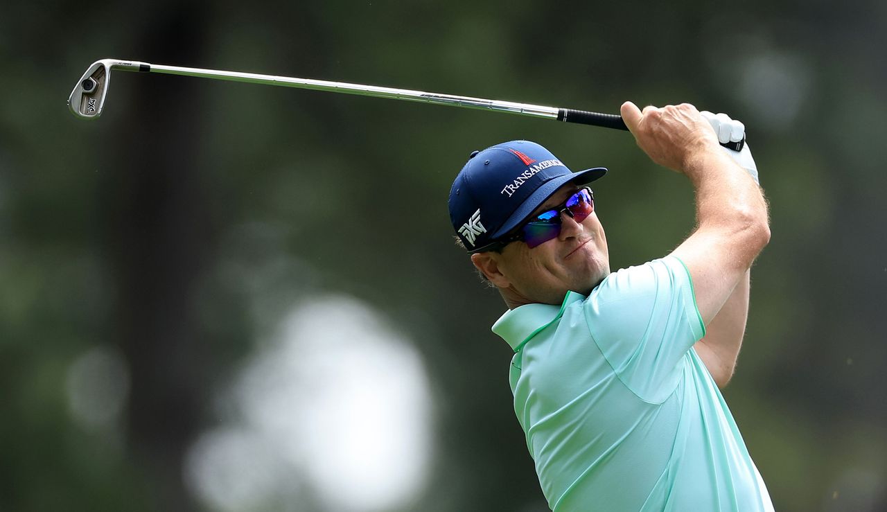 Zach Johnson hits an iron shot