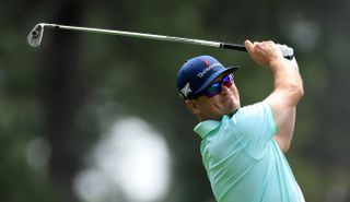 Zach Johnson hits an iron shot