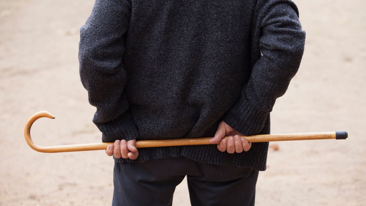 A person carrying a cane. 