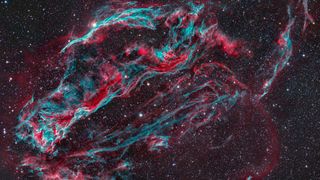 a cloud of red and green gas in space