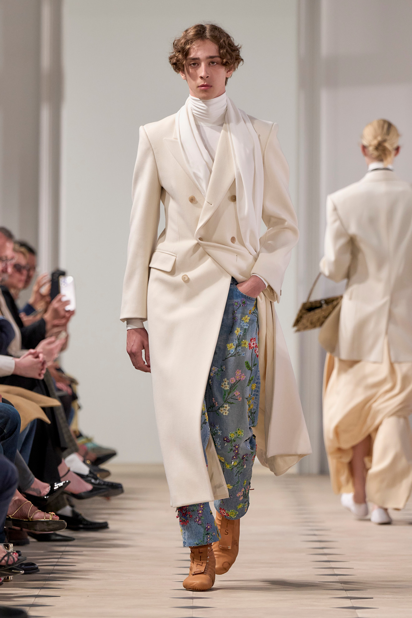 Model wears floral jeans on the Celine SS26 Runway.