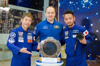 Billionaire entrepreneur Yusaku Maezawa (left), cosmonaut Alexander Misurkin (center) and video producer Yozo Hirano (right) are scheduled to launch toward the International Space Station on Dec. 8, 2021. Hirano will participate in health-related research during and after the mission.