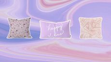 A trio of three Target throw pillows on purple swirled background