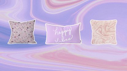 A trio of three Target throw pillows on purple swirled background