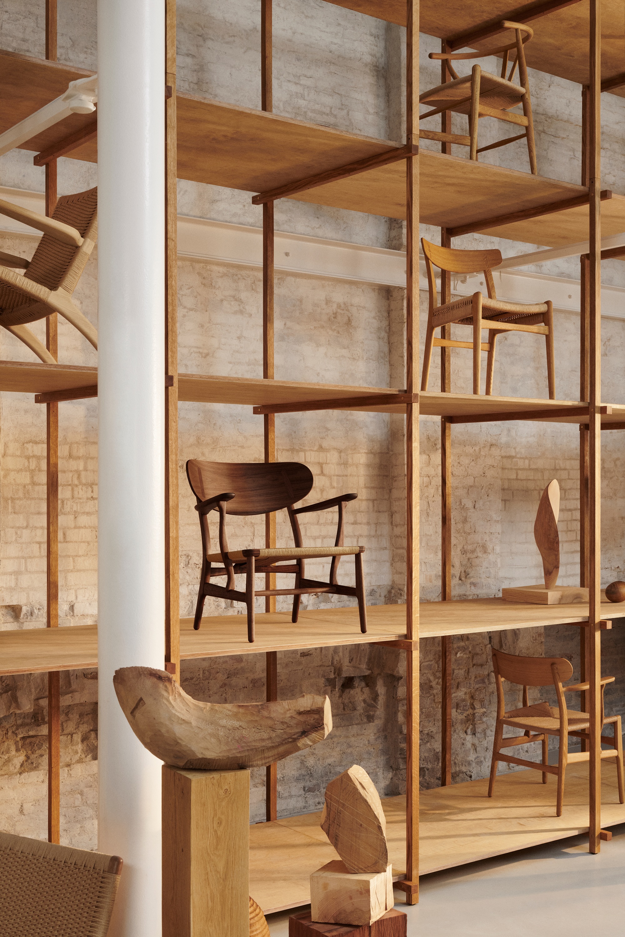 carl hansen chairs on a shelf in a showroom