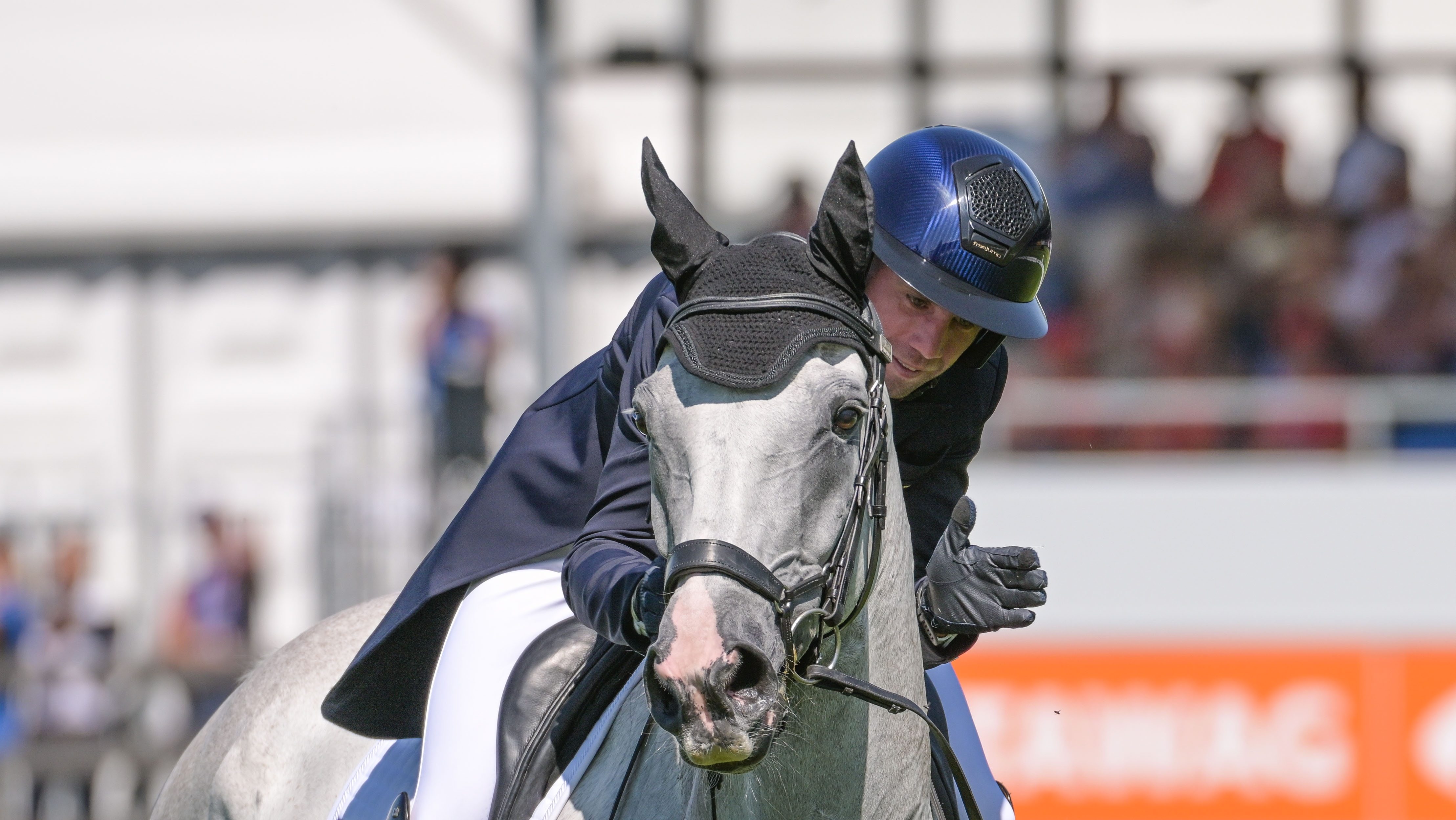 Alexis Goury pats Je&rsquo;Vall after performing his dressage test in hot weather at the World Championships in Aachen in August 2026