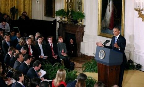 President Obama holds a news conference in the East Room of the White House on Nov. 14: The president did briefly address the David Petraeus affair.