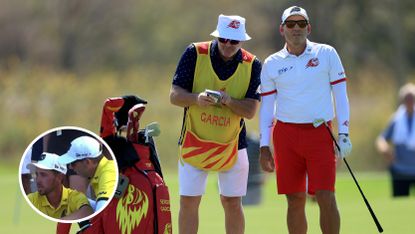 Sergio Garcia speaks to his caddie