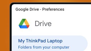 A laptop screen on an orange background showing the Google Drive desktop app