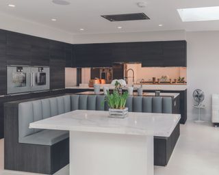 Grey booth style seating in modern kitchen design
