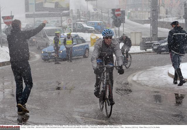 A lone Garmin-Sharp rider battles through the snow