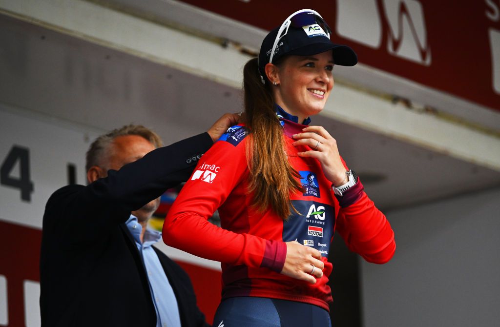 ASSEN NETHERLANDS OCTOBER 09 Ilse Pluimers of The Netherlands and AG Insurance Soudal Team celebrates at podium as Red most combative rider jersey winner during the 26th Simac Ladies Tour 2024 Stage 2 a 1548km stage from Coevorden to Assen on October 09 2024 in Assen Netherlands Photo by Luc ClaessenGetty Images