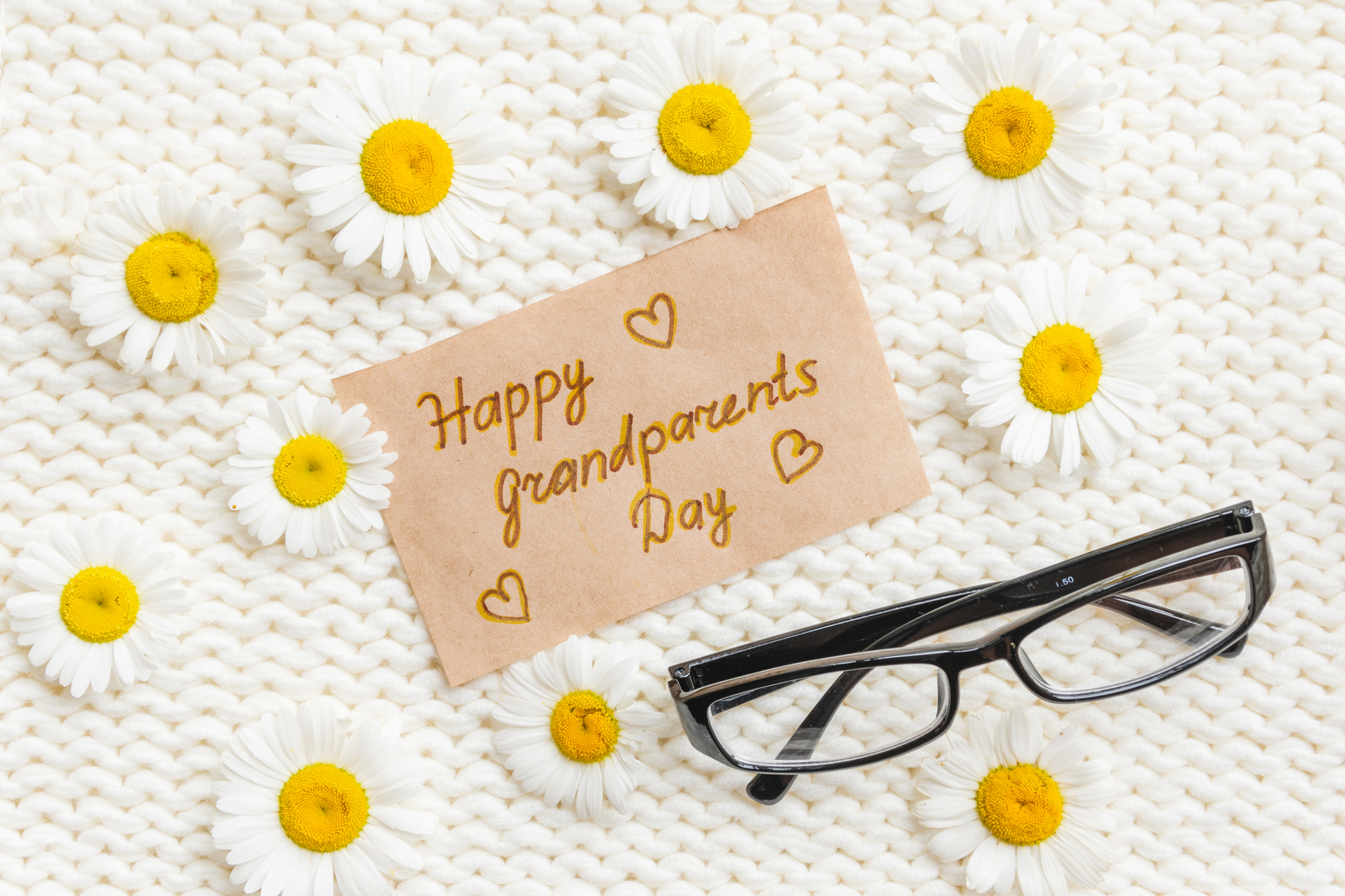 Note that says "Happy Grandparents Day" with glasses and daisies