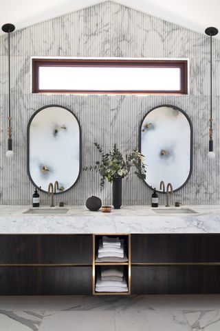 A bathroom vanity with a storage niche