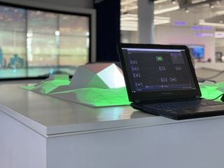 The projection table, which is powered by a custom software solution built using TouchDesigner, integrates four Christie DHD630-GS projectors.