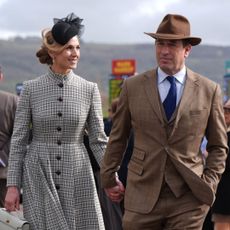 Harriet Sperling and Peter Phillips holding hands at Cheltenham Festival