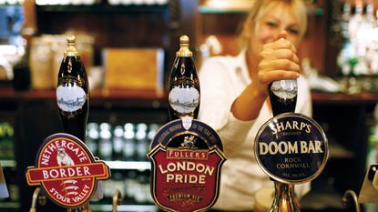 Barmaid pulling a pint