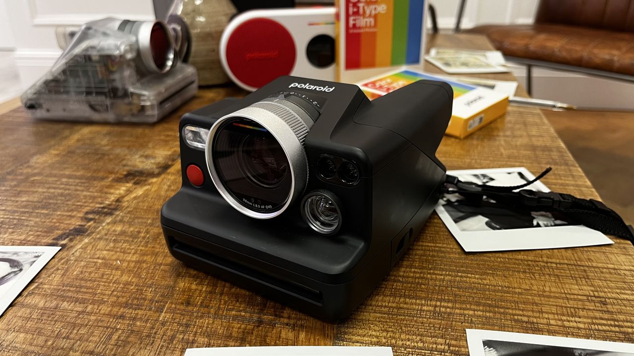 The Polaroid I-2 camera on a wooden table