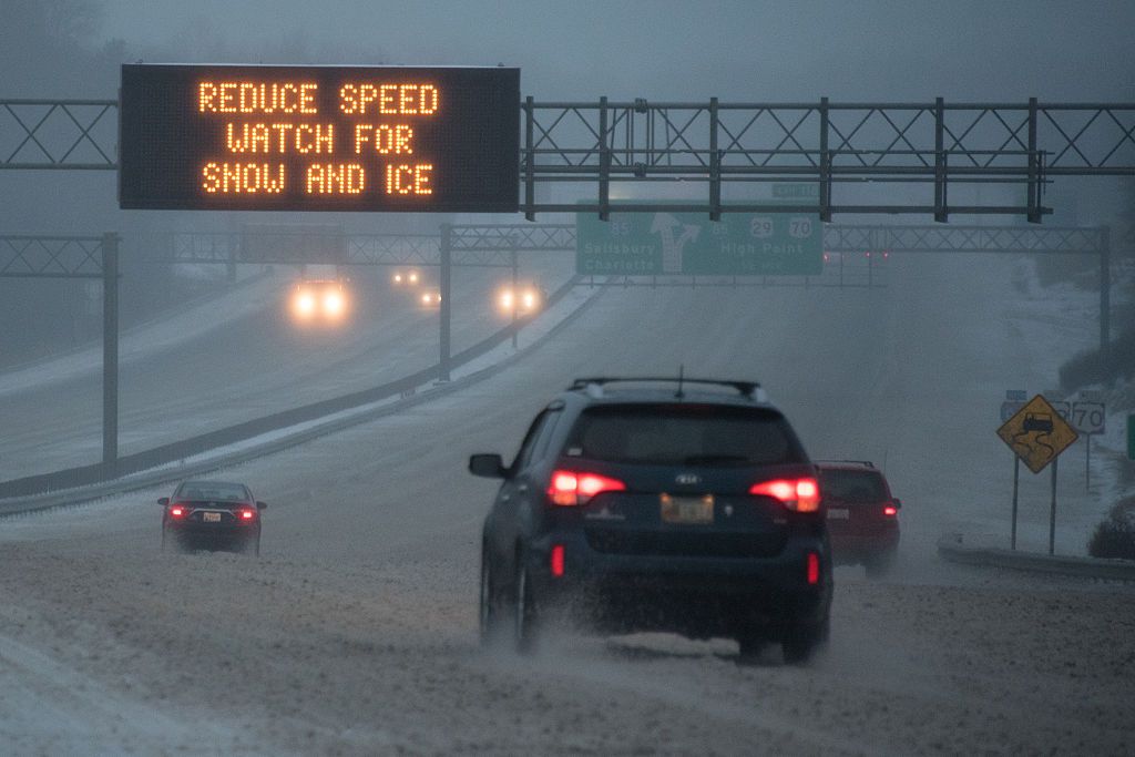 A car driving in dangerous winter weather