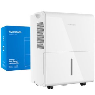 A white rectangular dehumidifier with a blue cardboard box behind it 