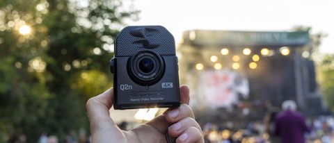 The Zoom Q2N-4K held in female hands at a summer festival
