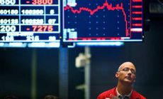 A Chicago trader looks glumly while waiting in the Standard & Poor's stock index futures pit Sept. 29, 2008.