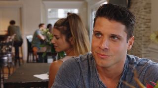 Cody Calafiore smiling in front of Ashley Brinkman in the Maltese Holiday.