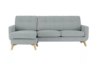 A retro chaise sofa in grey upholstery