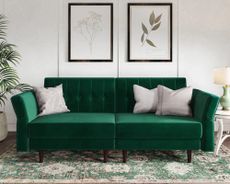 Learn how to clean a velvet couch and make it as spotless as this green velvet 3-in-1 convertible couch that functions as a sofa, sleeper sofa and two accent chairs in living room with wall paneling and traditional area rug