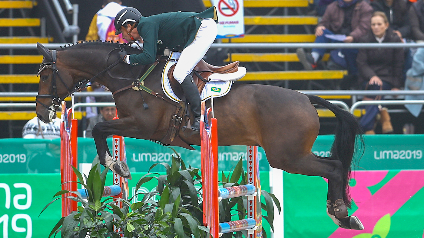 LIMA, PERU - AUGUST 04: Marcelo Tosi of Brazil rides Starbucks during Equestrian Eventing Individual - Jumping Final at Army Equestrian School on Day 9 of Lima 2019 Pan American Games on August 4, 2019 in Lima, Peru. (Photo by Daniel Apuy/Getty Images for FEI)
