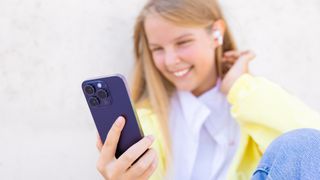 Teenage girl using iPhone 