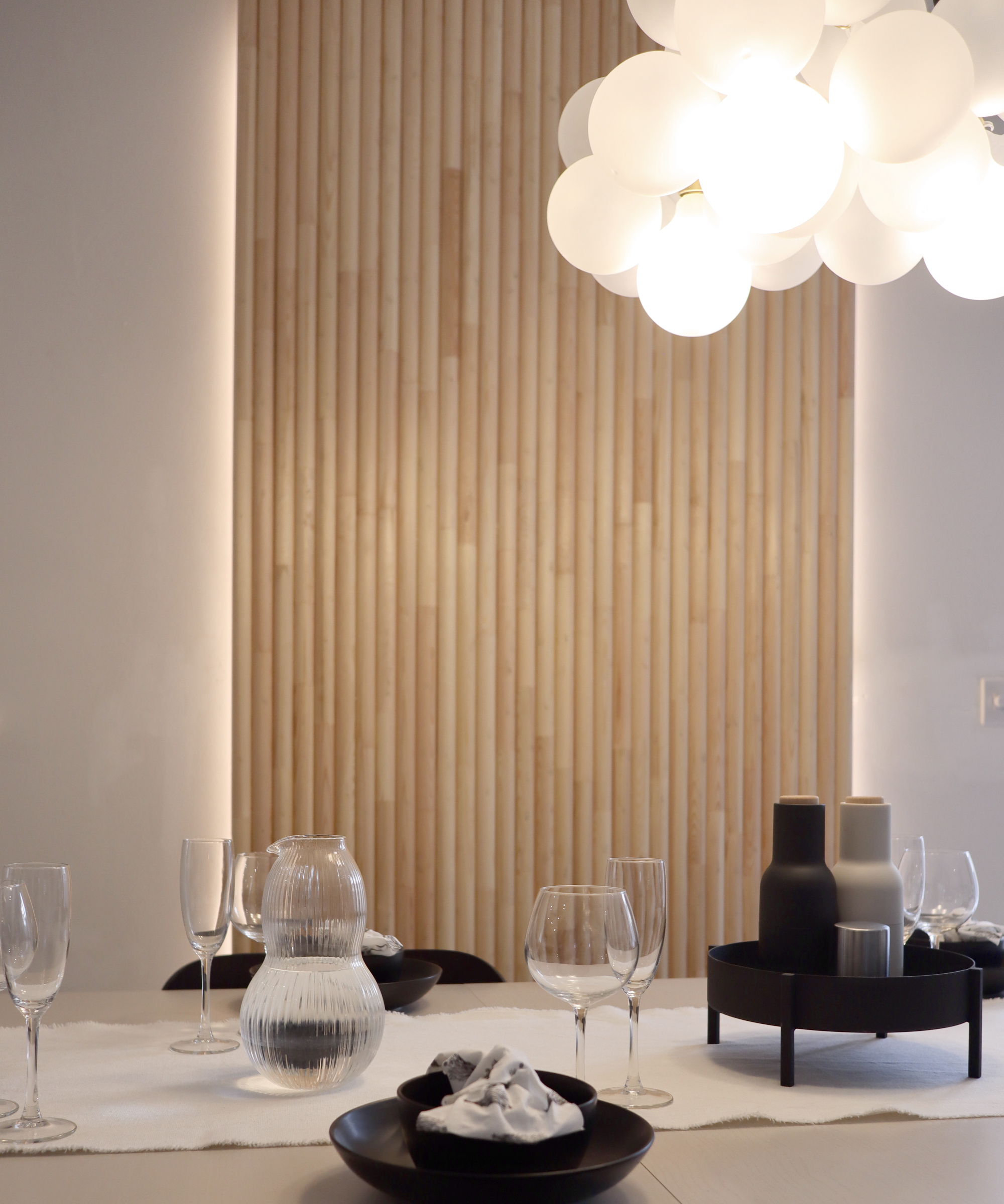 white opaqe bubble glass cluster pendant light above dining table