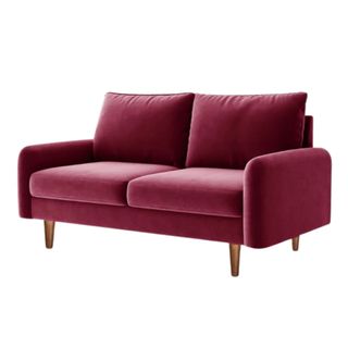 A two-seater burgundy red velvet loveseat